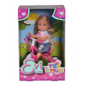 Doll Evi Love on a three-wheeled bike