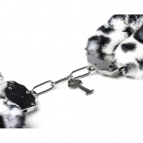 Erootilised metallist käerauad leopardimustriga karvaga, valge-must