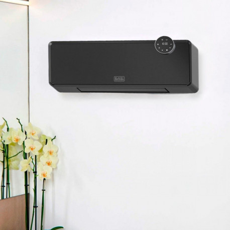 A portable device that warms a room by blowing air over an electric heating element.